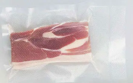 How much higher is the price of textured vacuum packaging bags compared to regular glossy vacuum bags?