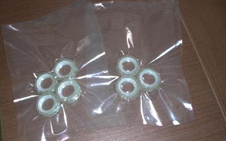 What causes the vacuum packaging bag to become brittle after sealing?